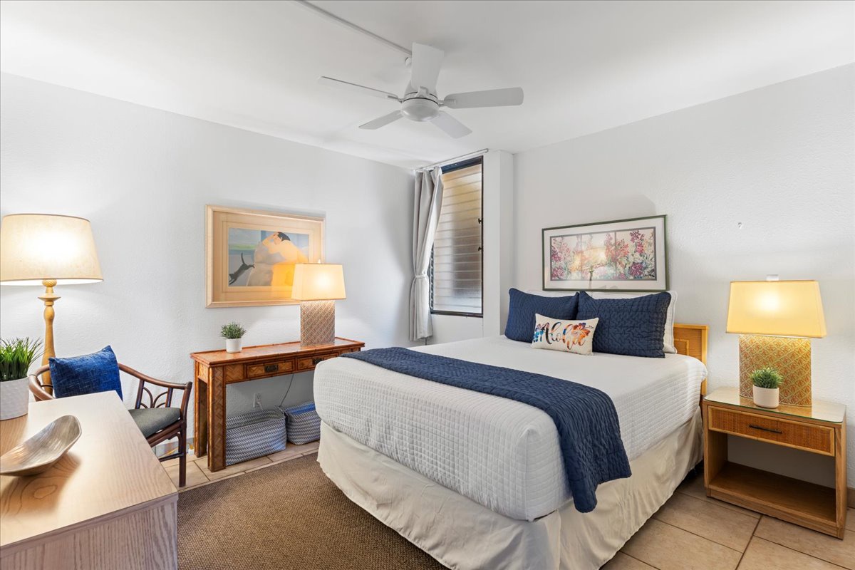 Relax and recharge in the comfortable bedroom featuring a cozy queen bed, perfect for restful nights after a day exploring Maui.