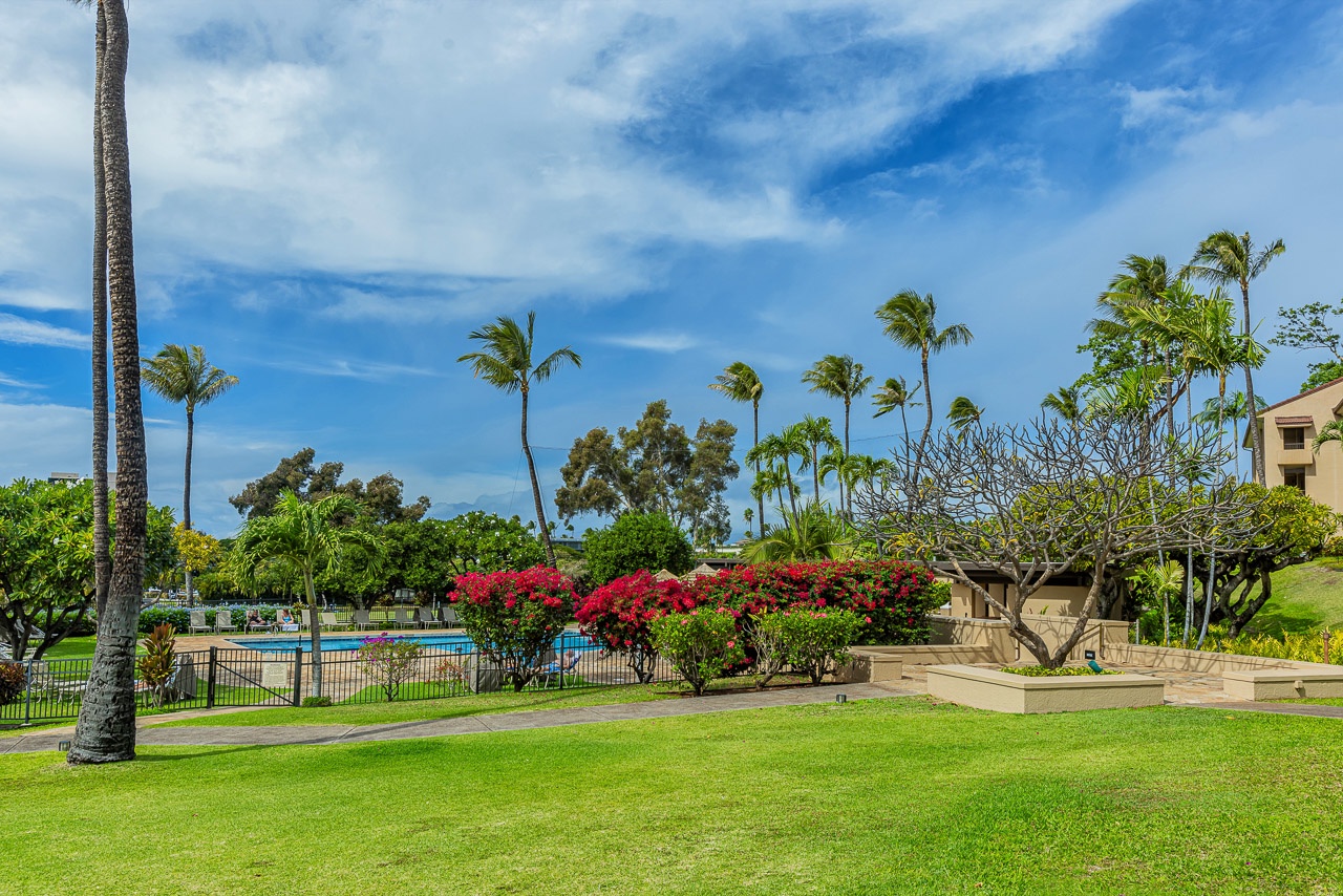 Lush tropical grounds with swaying palms, vibrant bougainvillea, and a sparkling pool set the scene for your island escape.