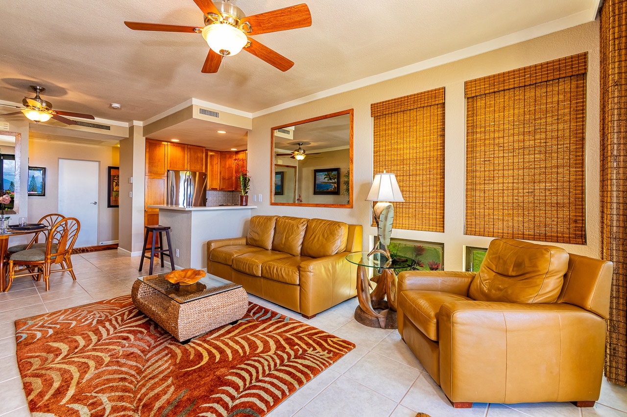 Sink into plush leather sofas as ceiling fans keep you cool. The open layout connects your living space to a full kitchen, perfect for relaxing after island adventures.