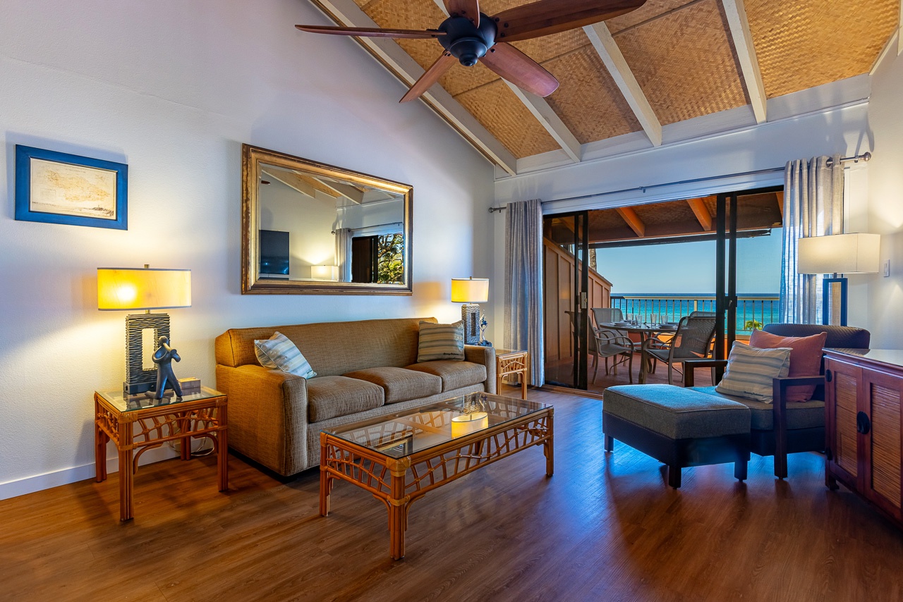 Gaze through open doors to your private balcony and the sparkling turquoise ocean beyond.