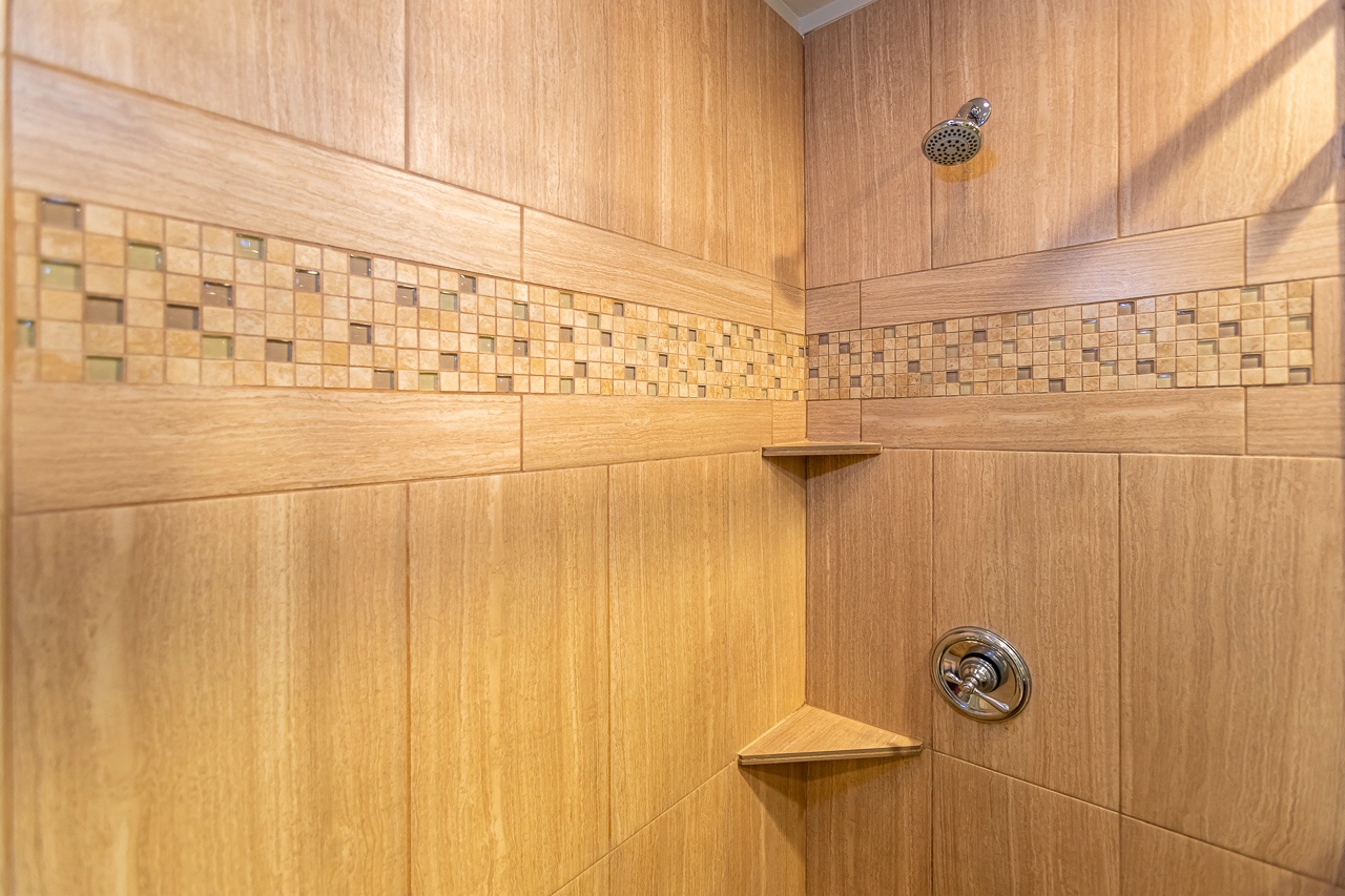 Freshen up after a day at the beach in the clean and relaxing bathroom.