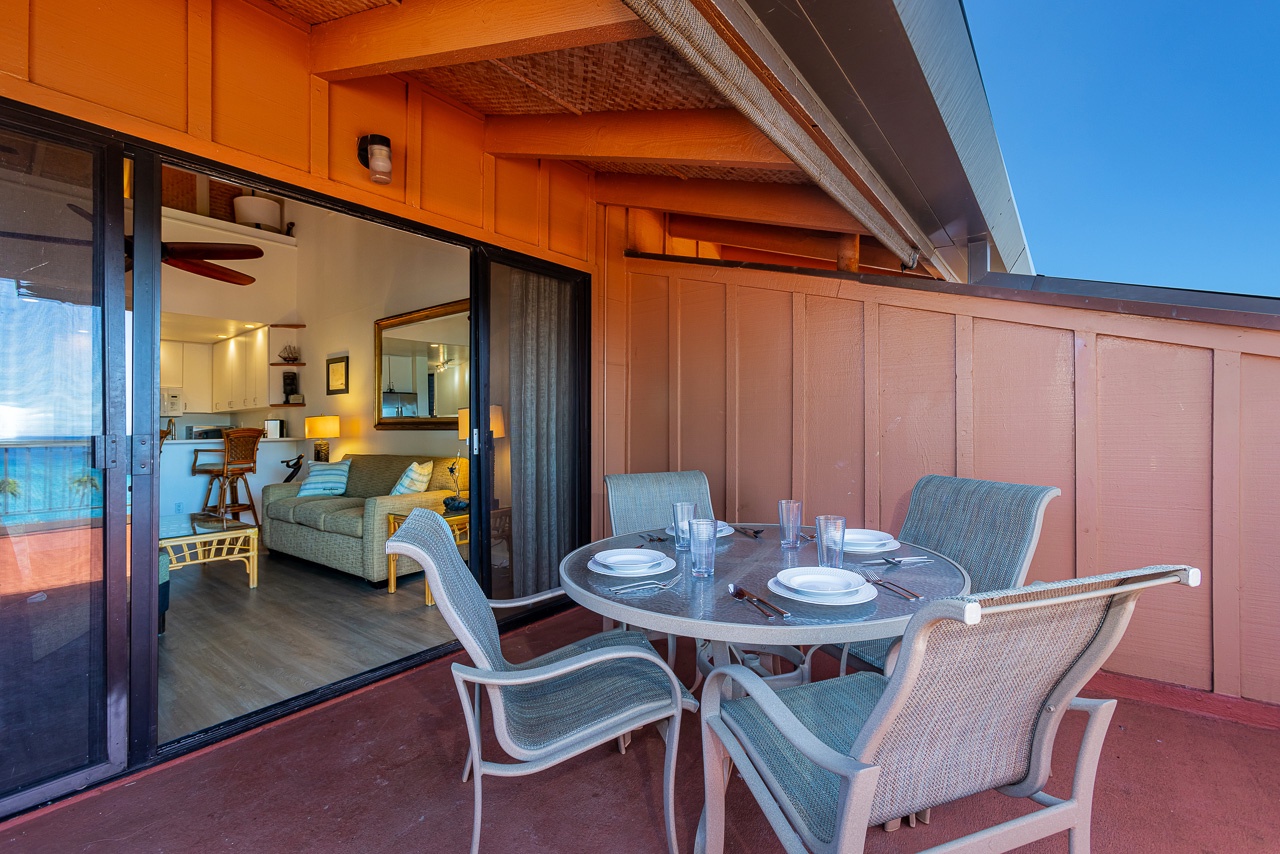 Dine al fresco at your own table, then sink into your cozy living room just beyond the open glass doors—your island escape awaits.