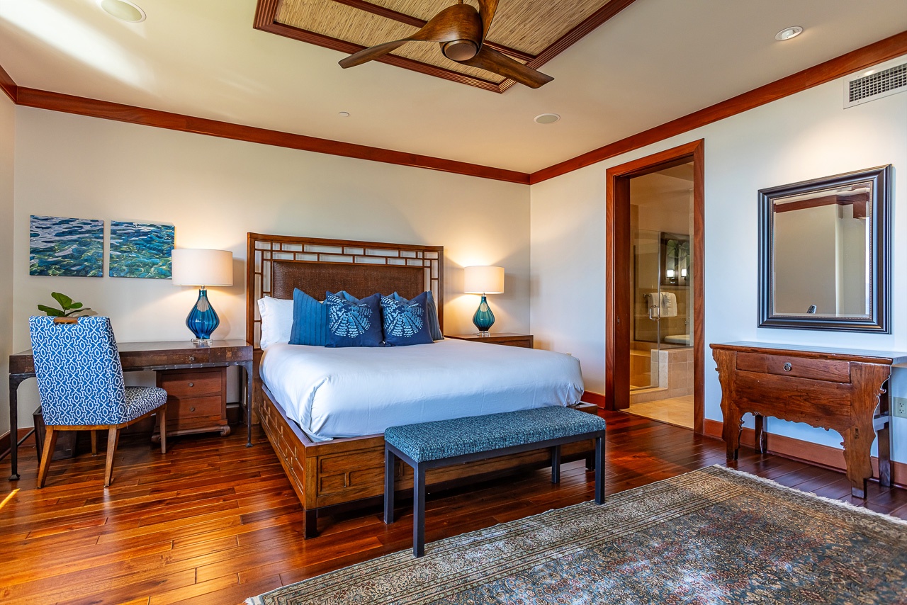 Drift off in your private sanctuary with coastal décor, rich wood floors, and a peaceful king bed dressed in ocean-inspired linens.
