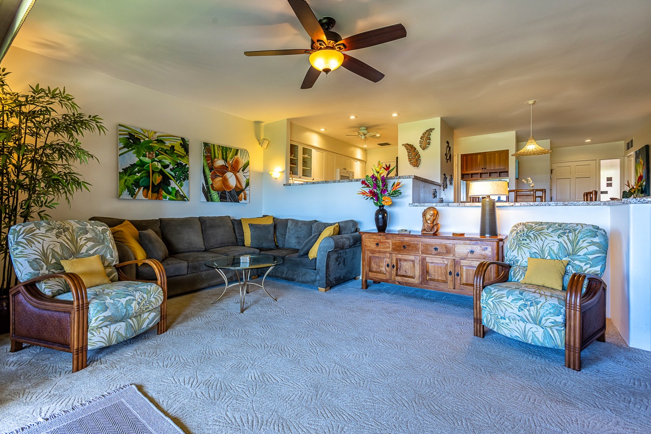 Sink into island-inspired comfort in your spacious living room, where tropical prints and plush seating create the perfect spot to unwind after a day exploring.
