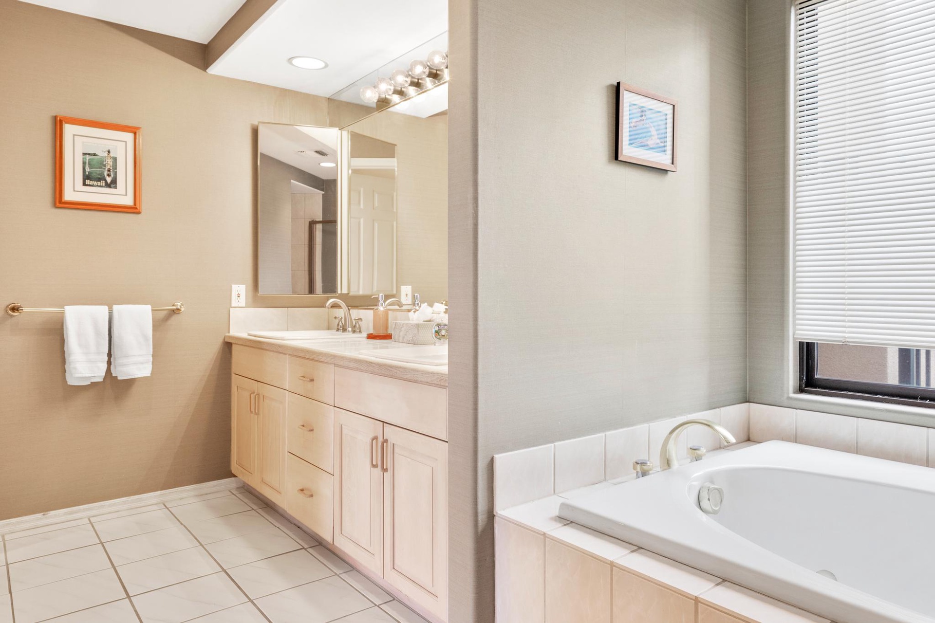 Refresh, relax, and slow down in this serene primary bath