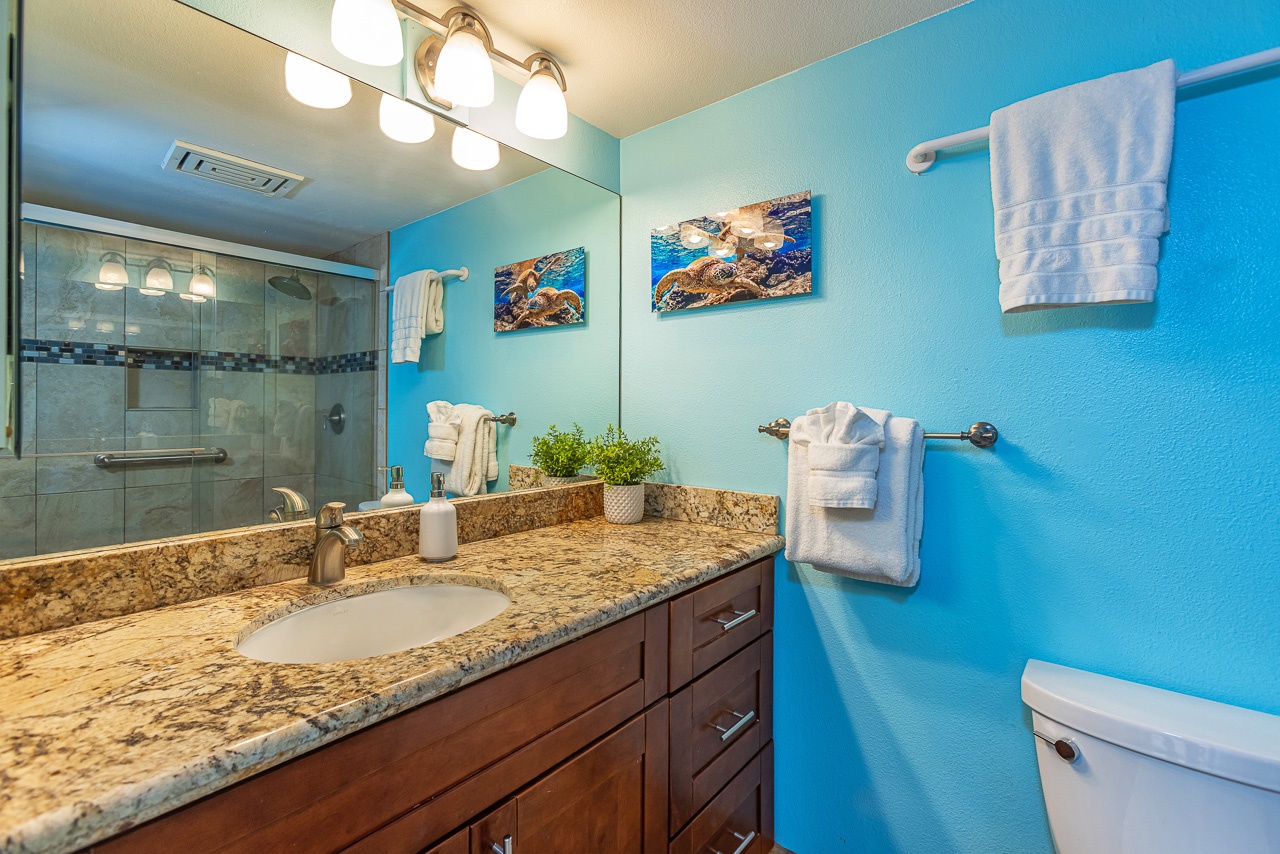 Step into your private coastal retreat, where ocean-inspired blues wrap around fresh white linens and warm granite.