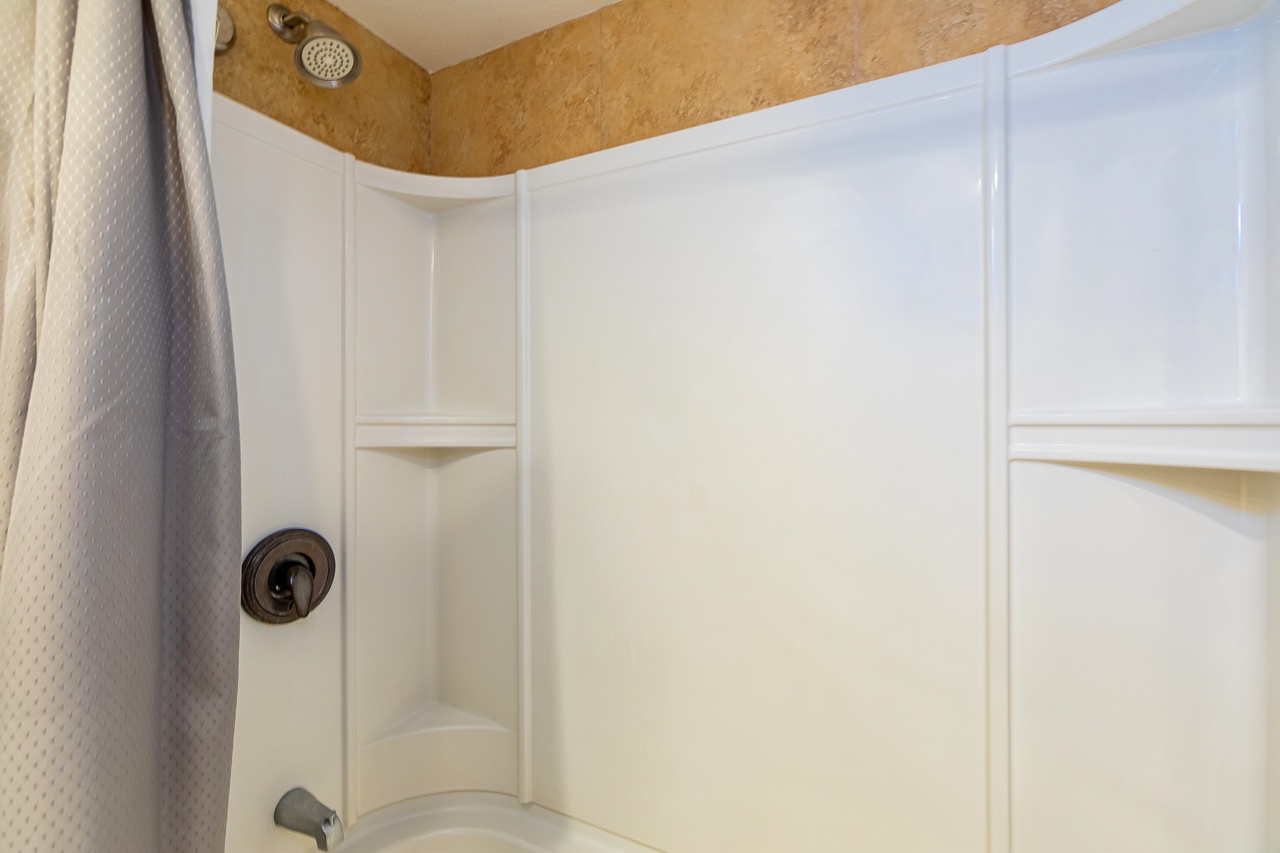 Step into the tub and let the warm water wash away the day—this clean, well-appointed shower awaits you after your adventures.