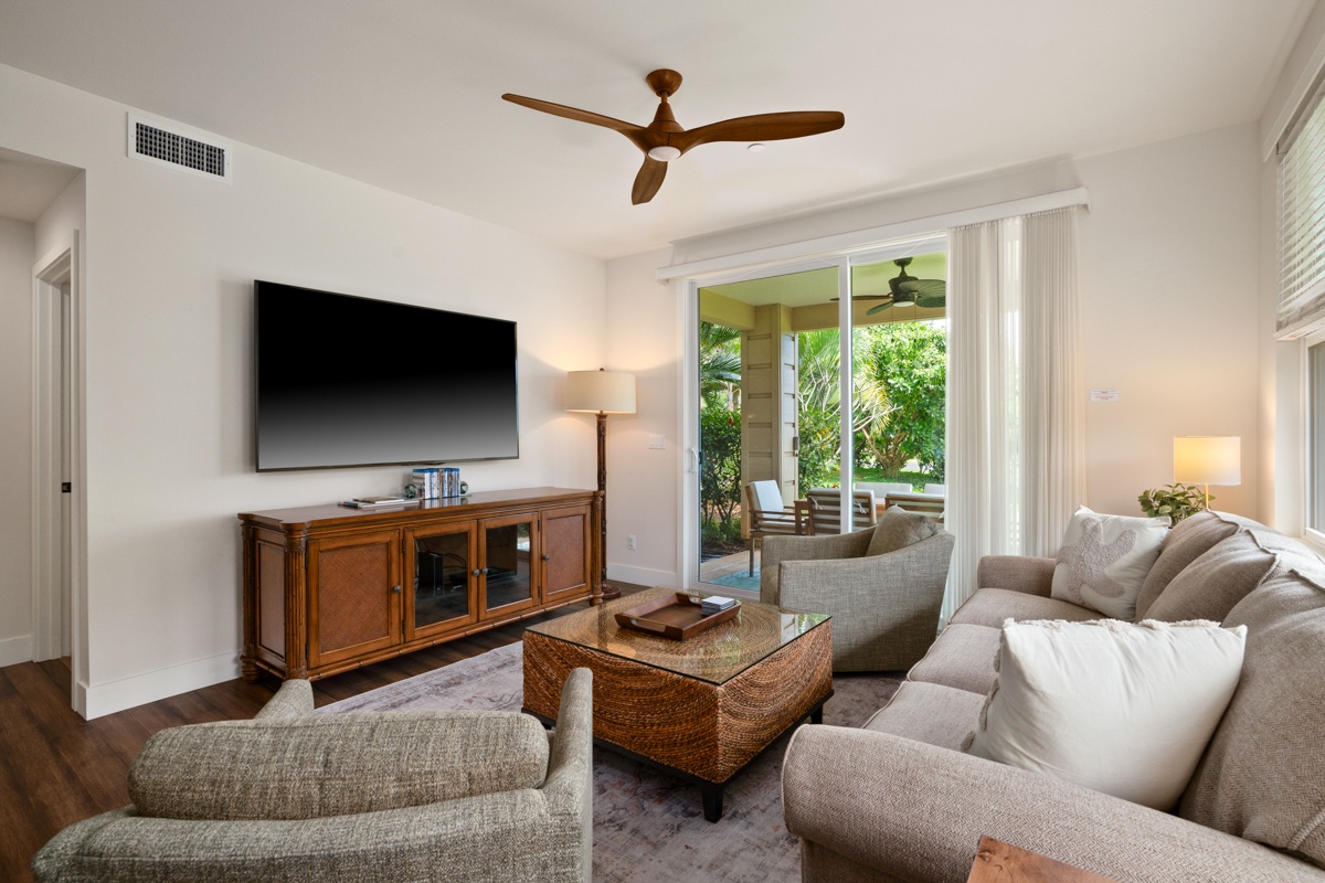 Relax in your beautifully appointed living space with plush seating, modern entertainment, and gentle ceiling fan breeze overhead.