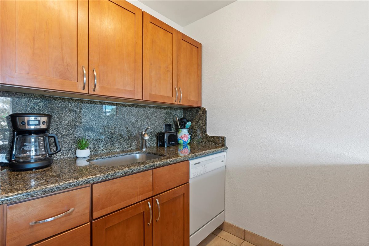 Your kitchenette features granite counters, warm wood cabinetry, and everything you need to prepare simple meals—including a coffee maker for easy mornings.