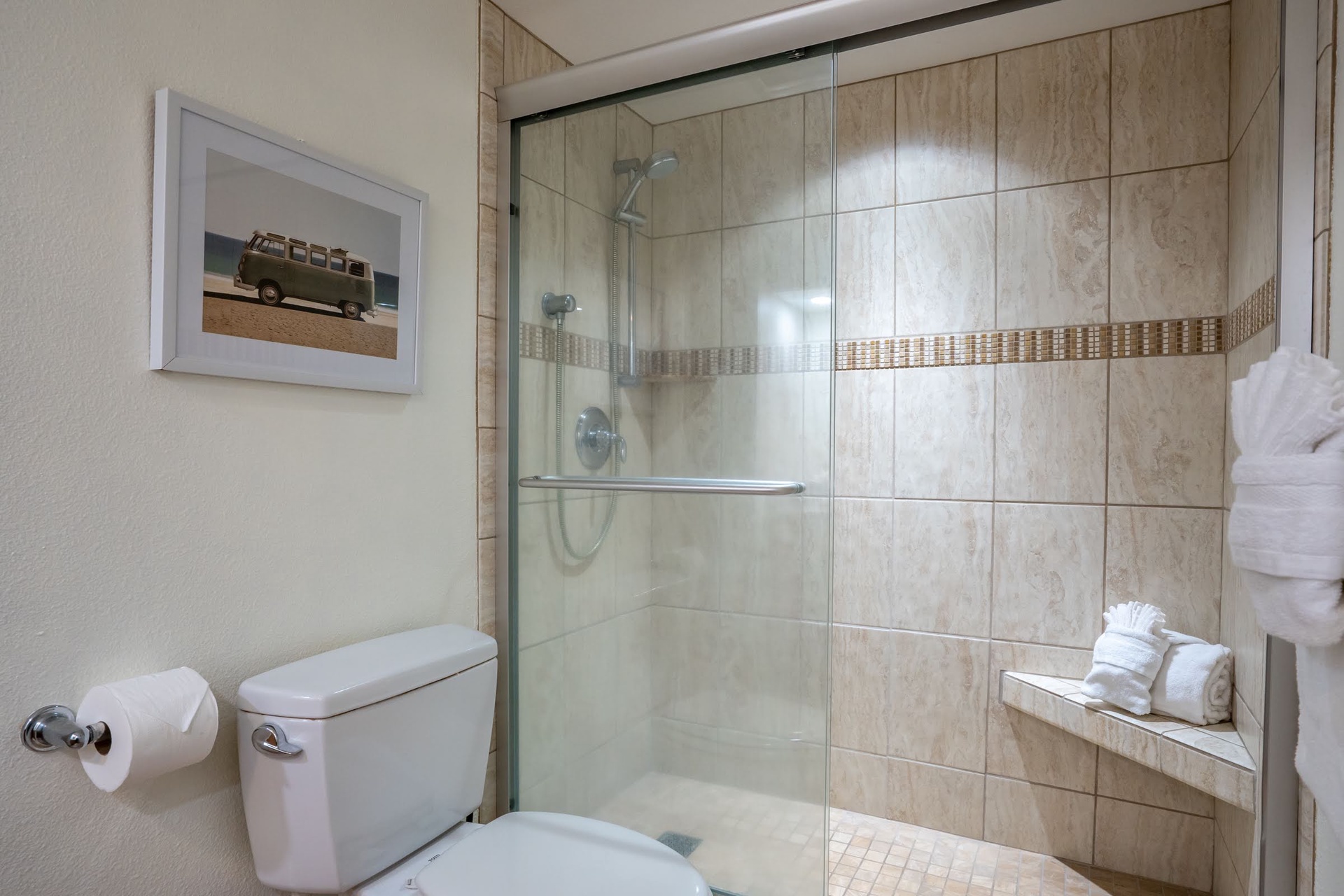 Spacious bathroom with walk in shower.