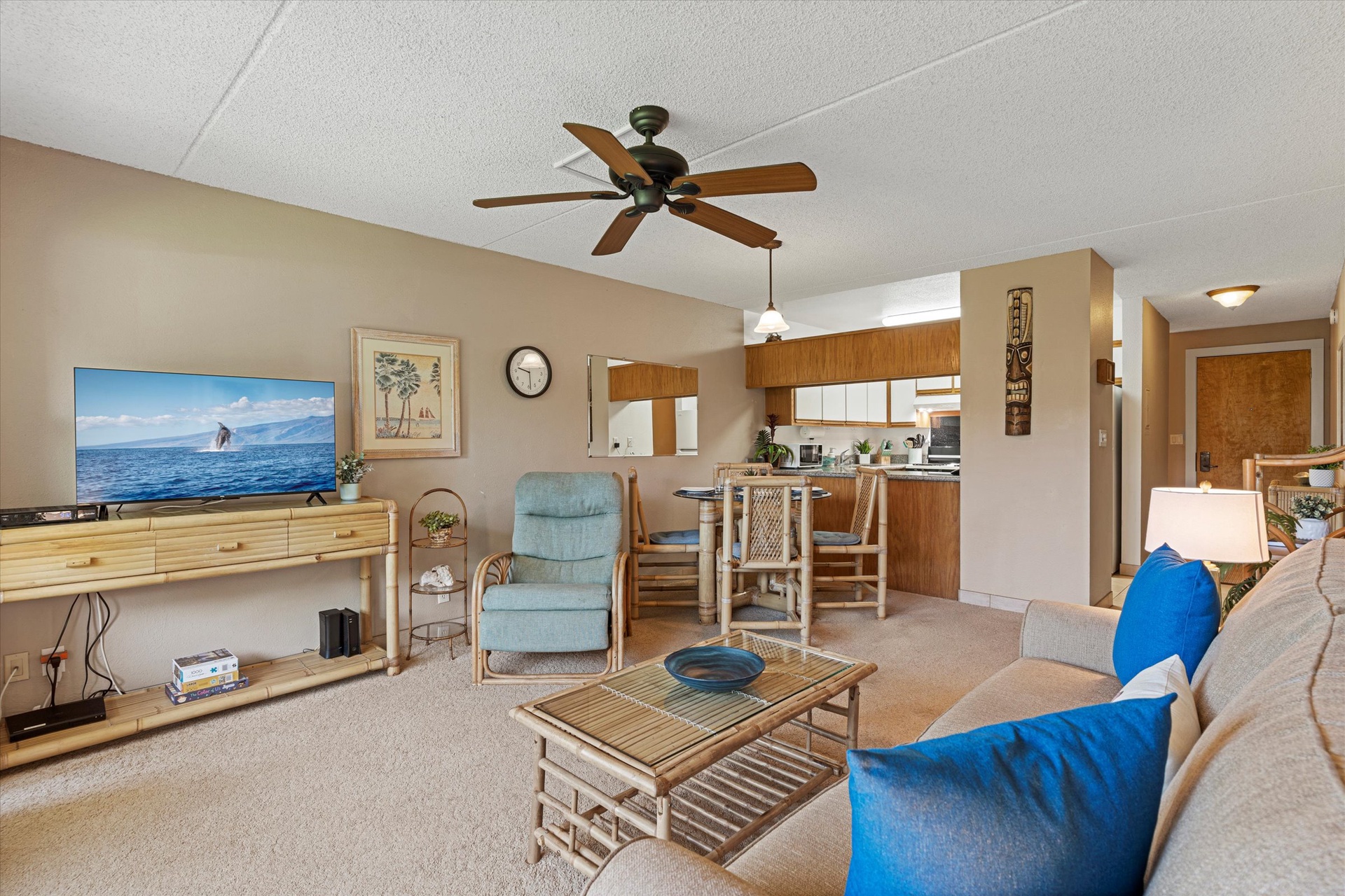 Unwind in your open-concept retreat where comfortable seating, a full kitchen, and ocean-themed décor create a welcoming island vibe for your stay.