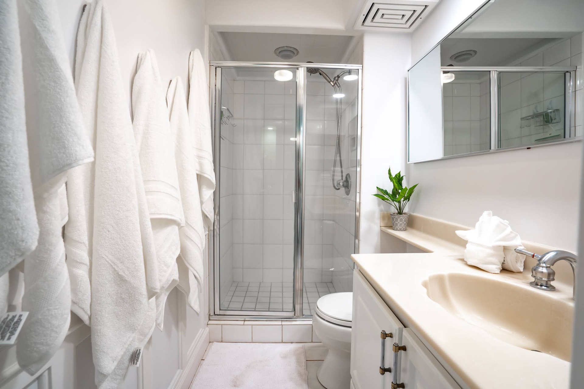 Your private bathroom offers a refreshing walk-in shower, plush towels, and modern fixtures—everything you need for a comfortable stay.