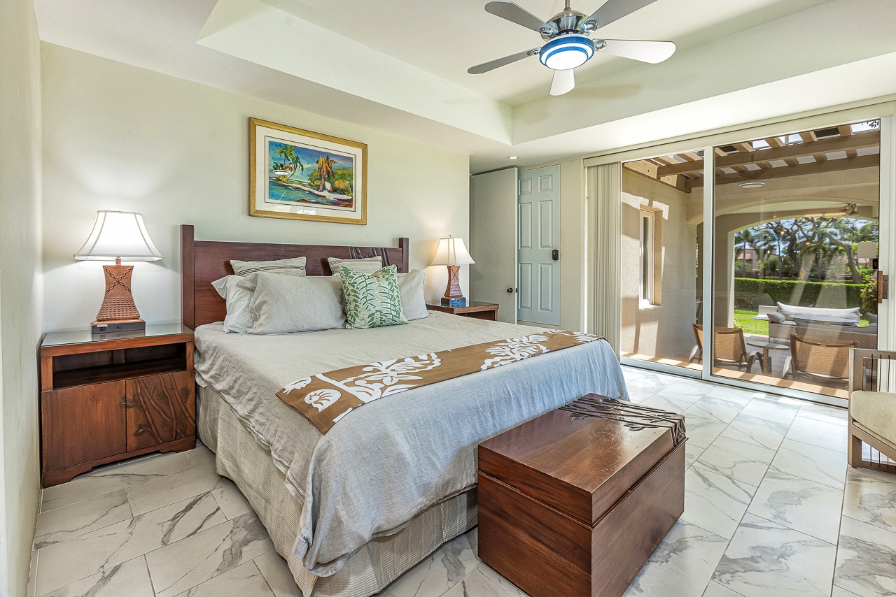 Picture yourself drifting off in this serene bedroom, where tropical breezes flow through your private lanai and soft island light welcomes each morning. Your peaceful retreat awaits.
