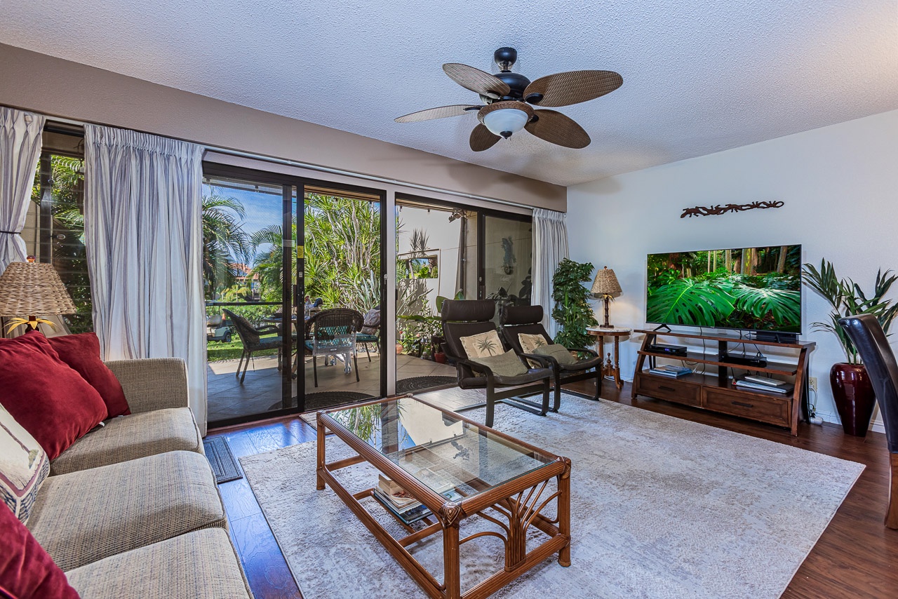 Relax in the living space where comfort meets island charm, with stunning garden views from your private lanai.