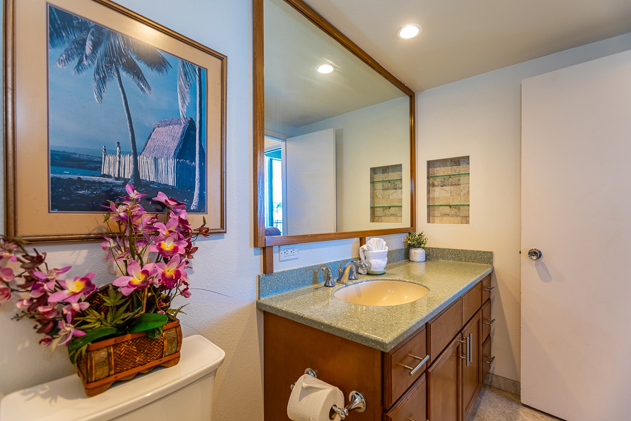 Primary bathroom with a full size vanity and storage drawers.