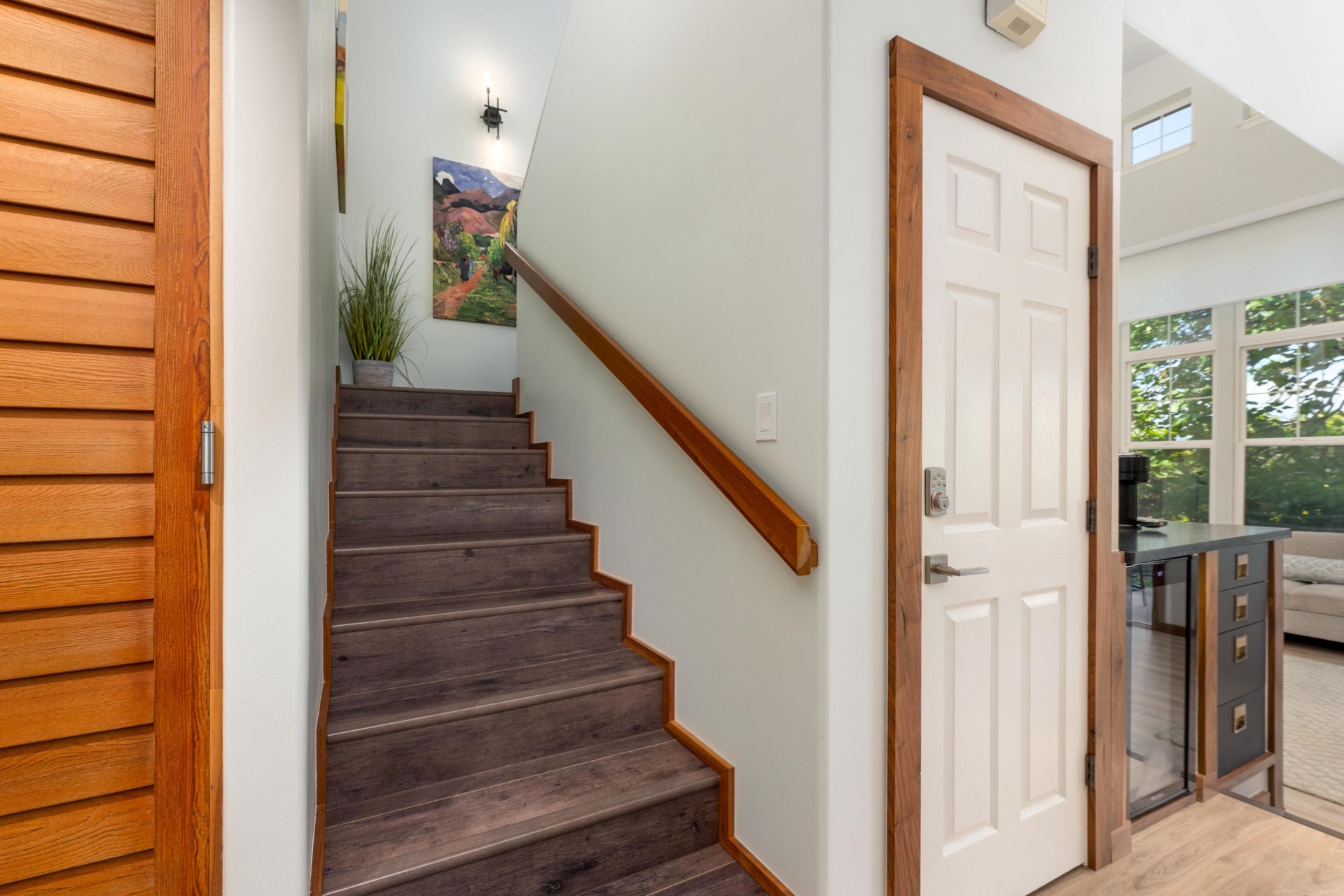 Step into your welcoming entryway, where warm wood tones and thoughtful details create an inviting atmosphere for your stay.