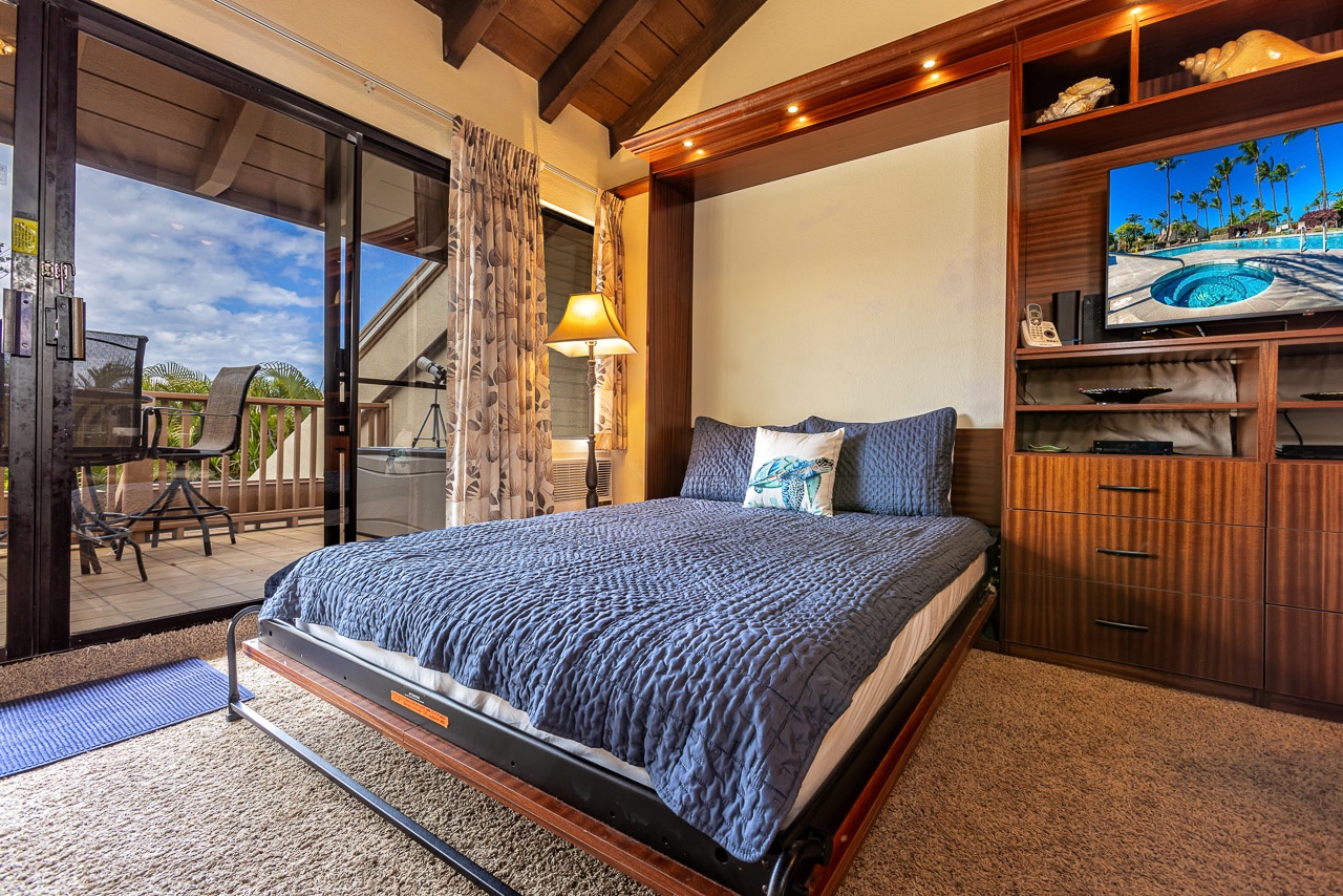 Drift off in this inviting bedroom where a plush Murphy bed folds out for your comfort, and the private balcony invites you to sip morning coffee while taking in views of swaying palms and island skies.