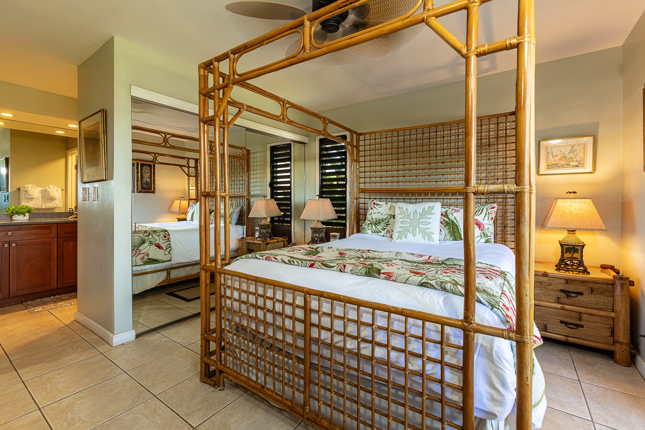 You'll love relaxing in this tropical-inspired bedroom with its striking bamboo canopy bed, soothing botanical linens, and warm island ambiance perfect for your getaway.