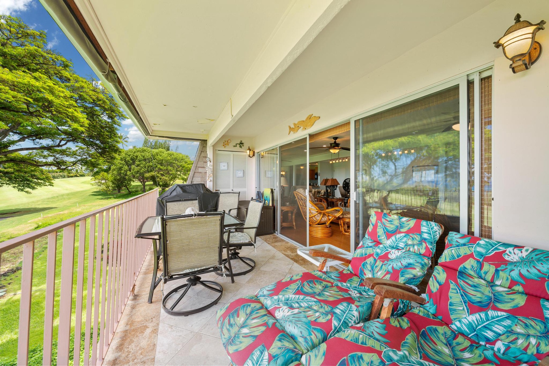 Sip your morning coffee on your private lanai, gazing at tropical greens while colorful cushions invite afternoon relaxation.