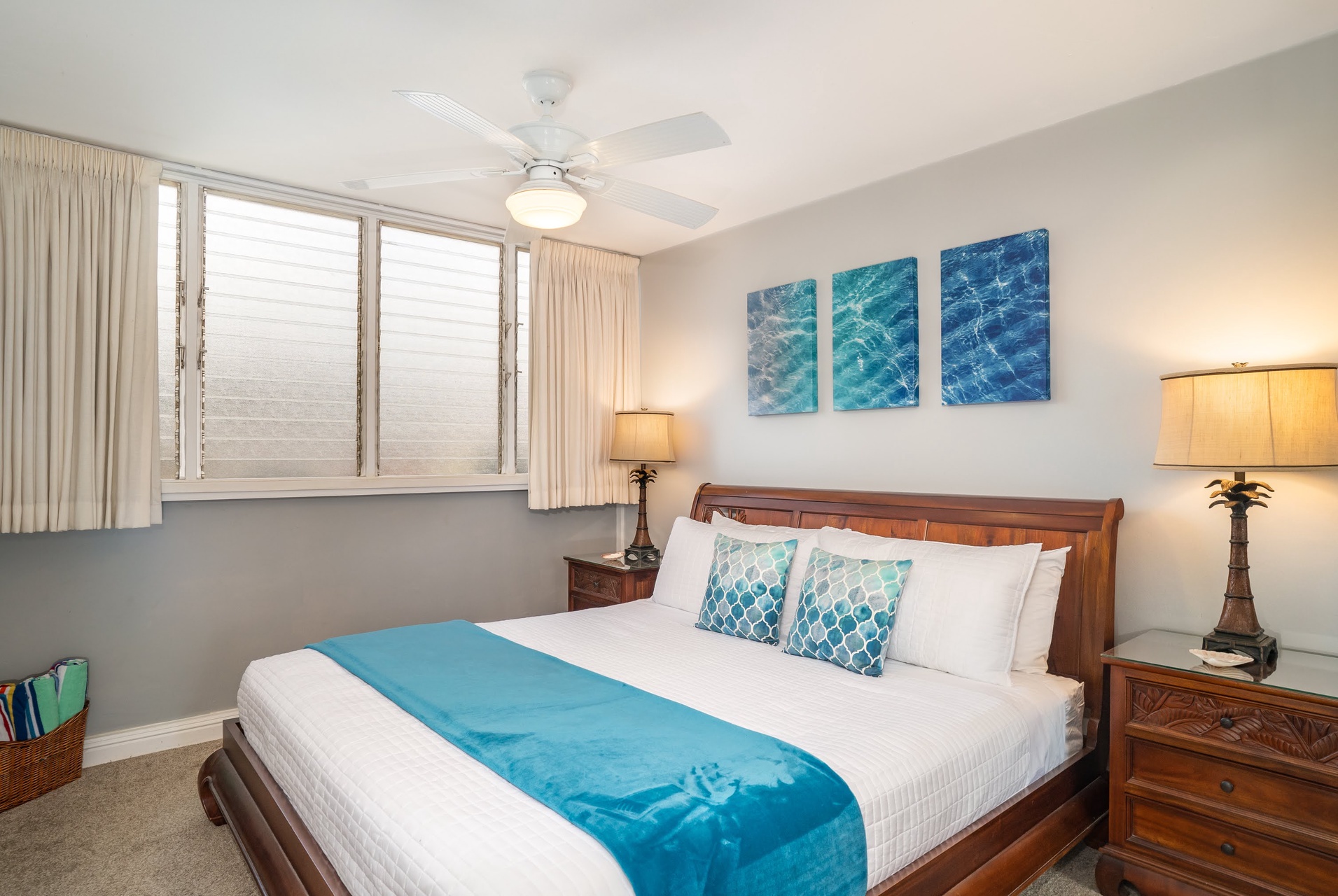 Relax and recharge in the spacious bedroom featuring a comfortable king-size bed and soothing ocean-inspired décor.