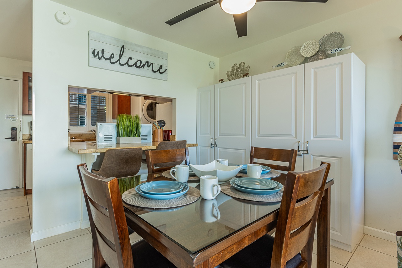 Start your morning at this welcoming dining table, perfectly set with coastal-blue dishes and just steps from your fully equipped kitchen.