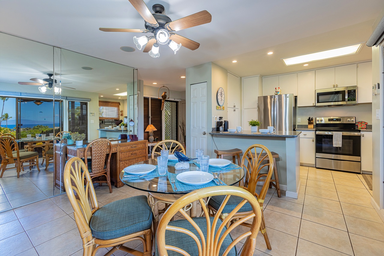 Gather around the glass-top table for meals with ocean breezes, then step into the fully equipped kitchen where stainless steel appliances and ample counter space make cooking a joy.
