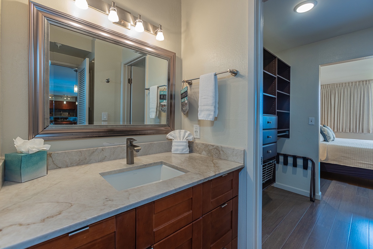 Freshen up in your elegant bathroom with marble countertops and fluffy towels