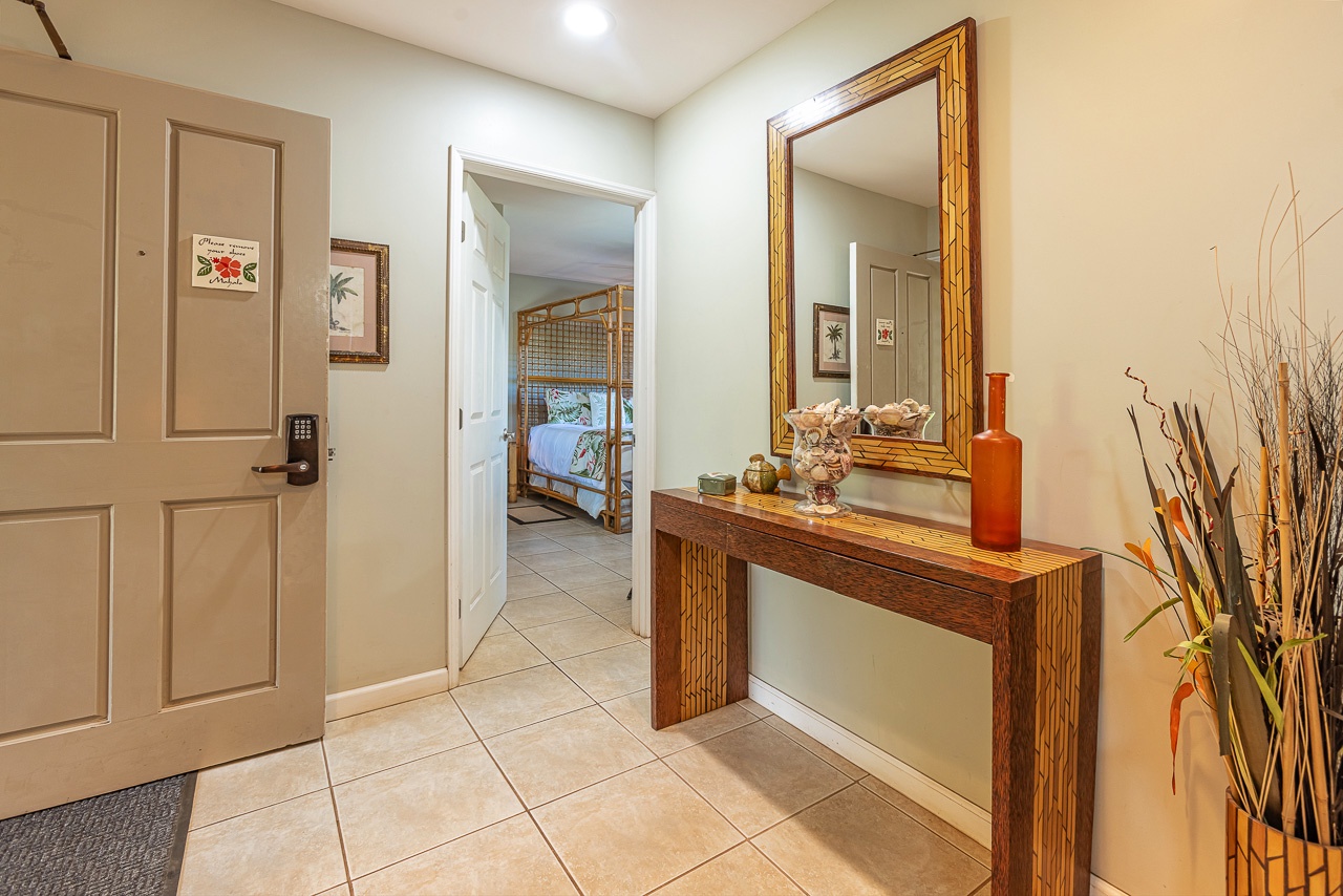 Step into your welcoming entryway with warm tile floors, elegant wooden furnishings, and thoughtful décor that sets the tone for a cozy, relaxing stay.