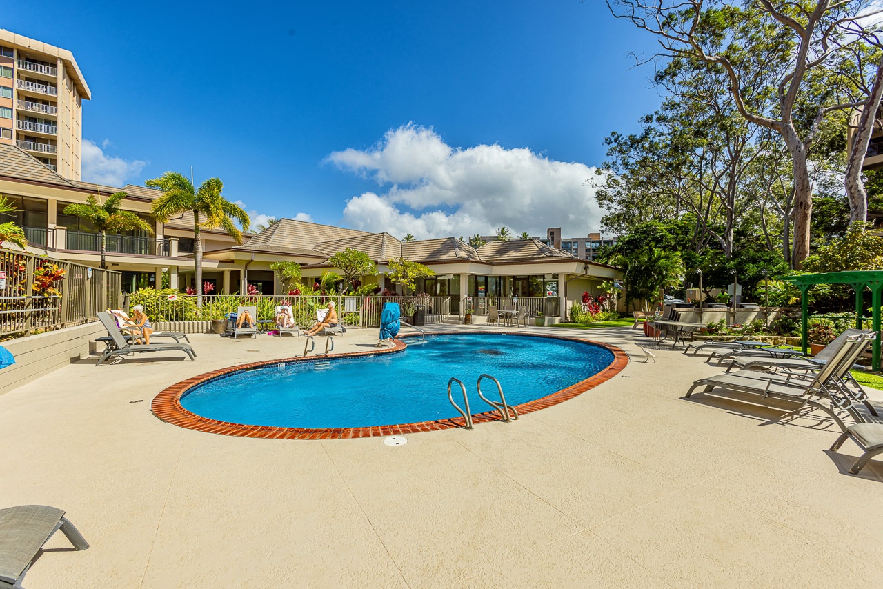 Relax by the sparkling pool with plenty of loungers for soaking up the sun, surrounded by lush tropical landscaping and a serene courtyard setting.