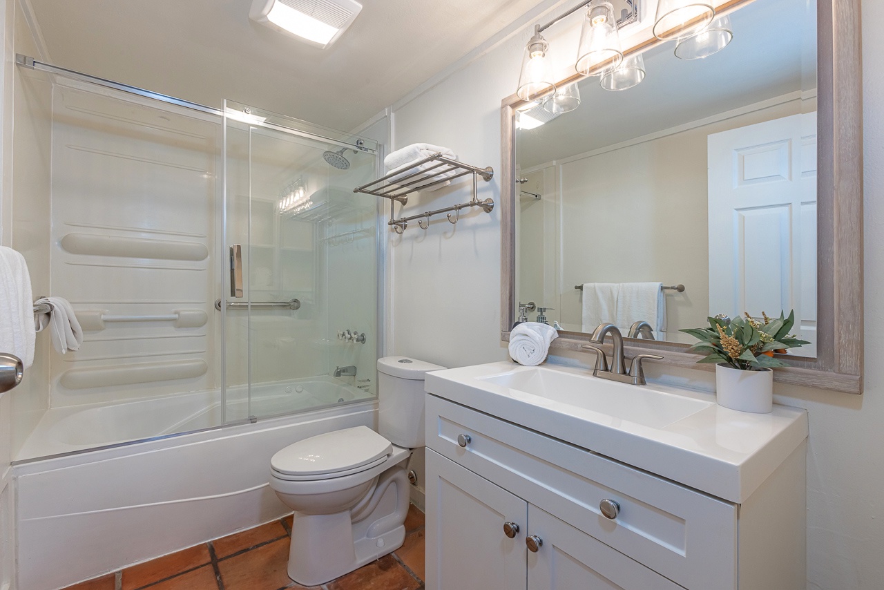 Relax in a clean, bright bathroom with a soothing tub