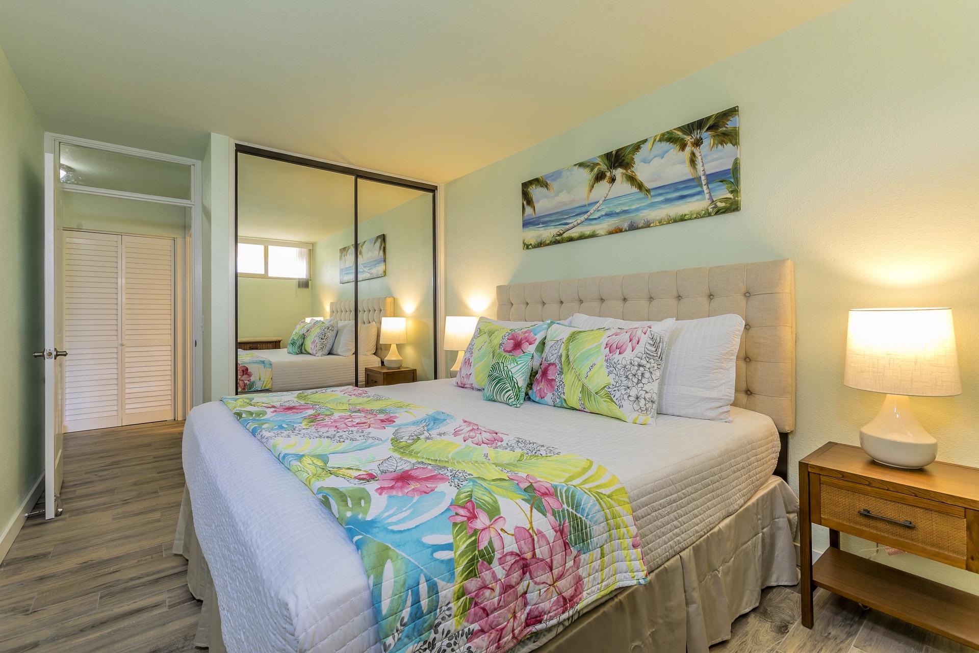 Sink into this plush tufted bed with tropical bedding and wake refreshed in your bright, cheerful bedroom with coastal charm.