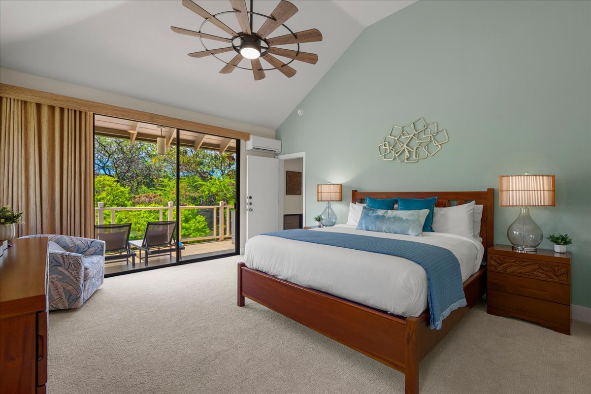 Wake up to lush garden views through your private balcony doors. Your serene bedroom features a plush king bed, calming coastal colors, and gentle ceiling fan breezes for ultimate relaxation.