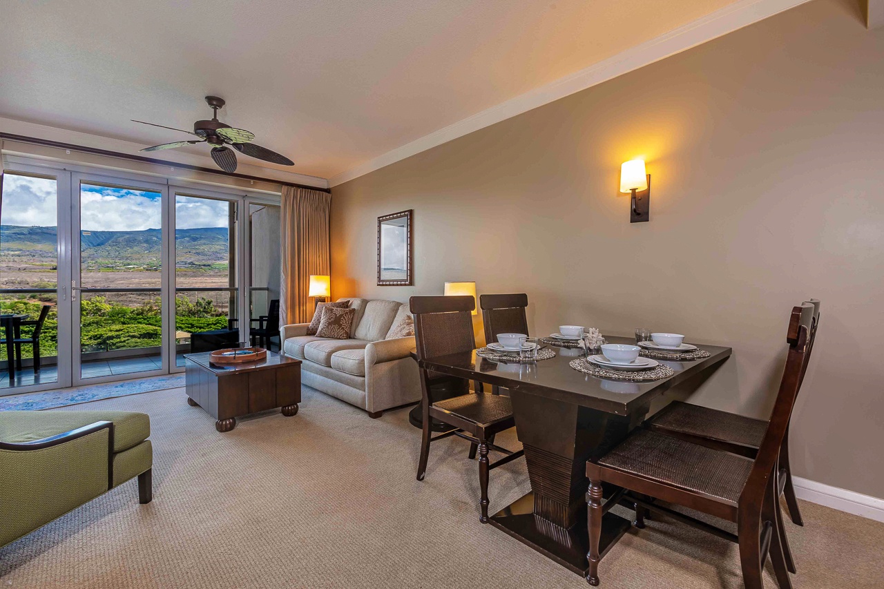 Step into your open-plan retreat where a cozy living space flows into a dining area perfect for shared meals.