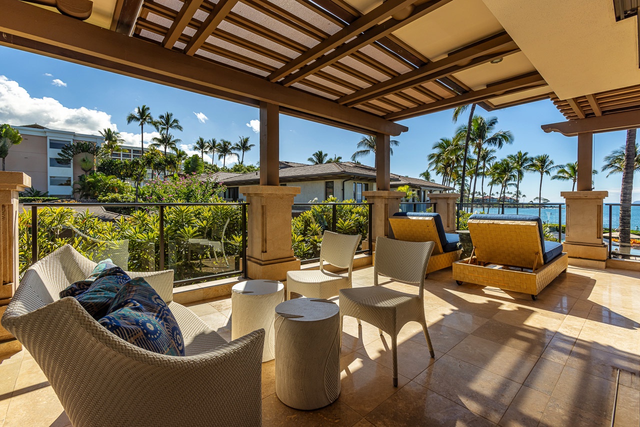 Settle into your private lanai with plush seating, tropical breezes, and stunning views of swaying palms and the sparkling ocean beyond.