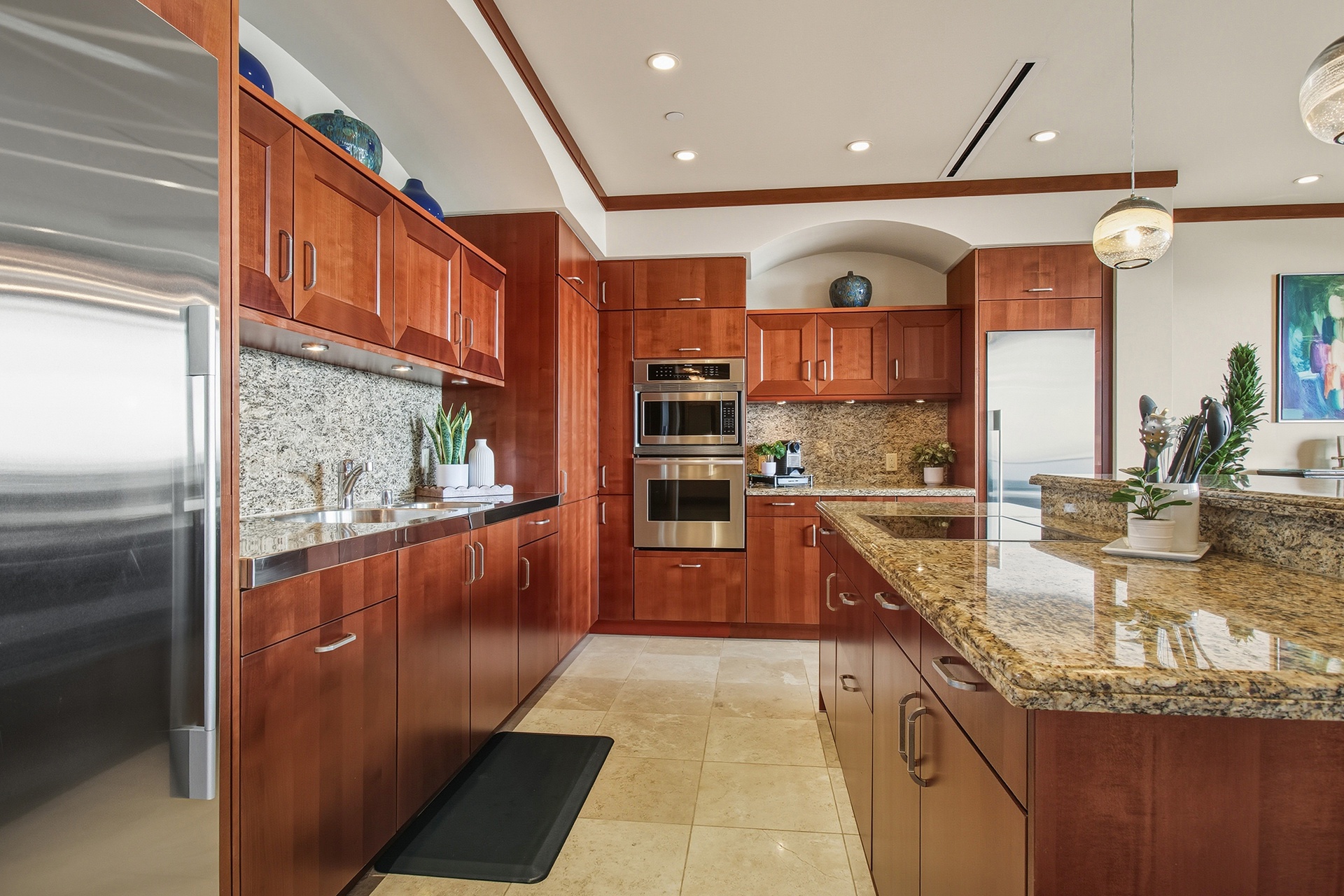 Your gourmet kitchen awaits with granite counters, cherry cabinets, and premium appliances