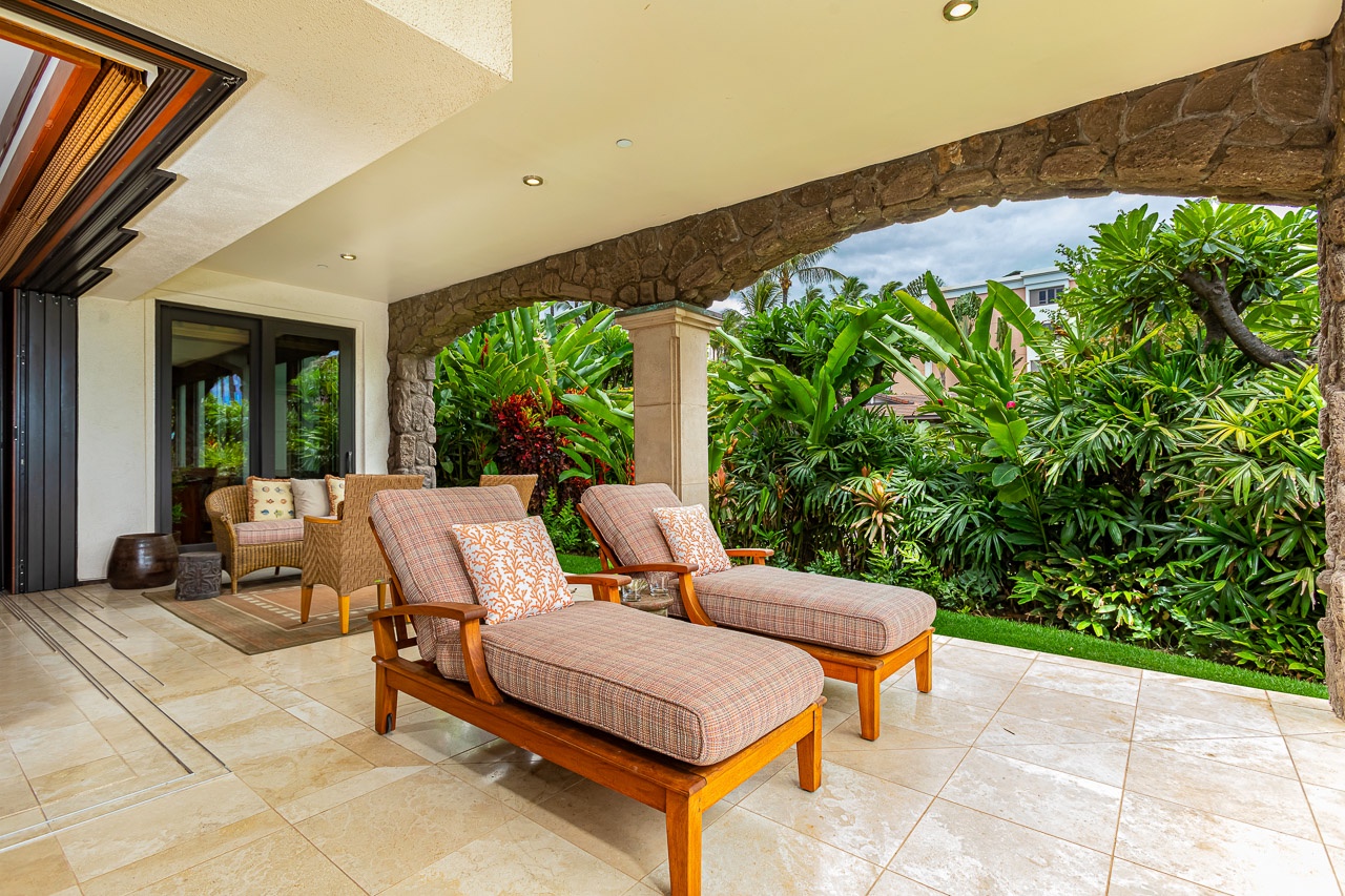 Stretch out on your private patio and soak in the lush tropical garden views. With shaded loungers and a peaceful green backdrop, this is your perfect spot to unwind and recharge.