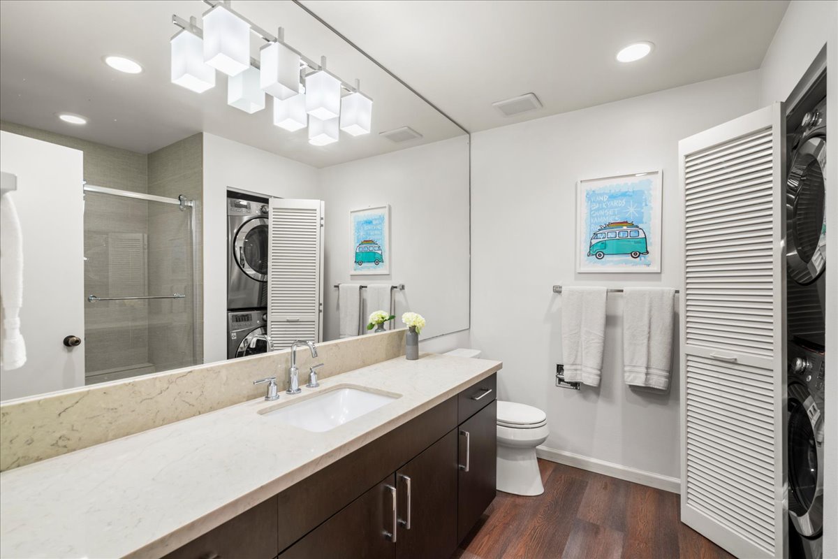 Washer and dryer behind the doors in the primary bathroom.
