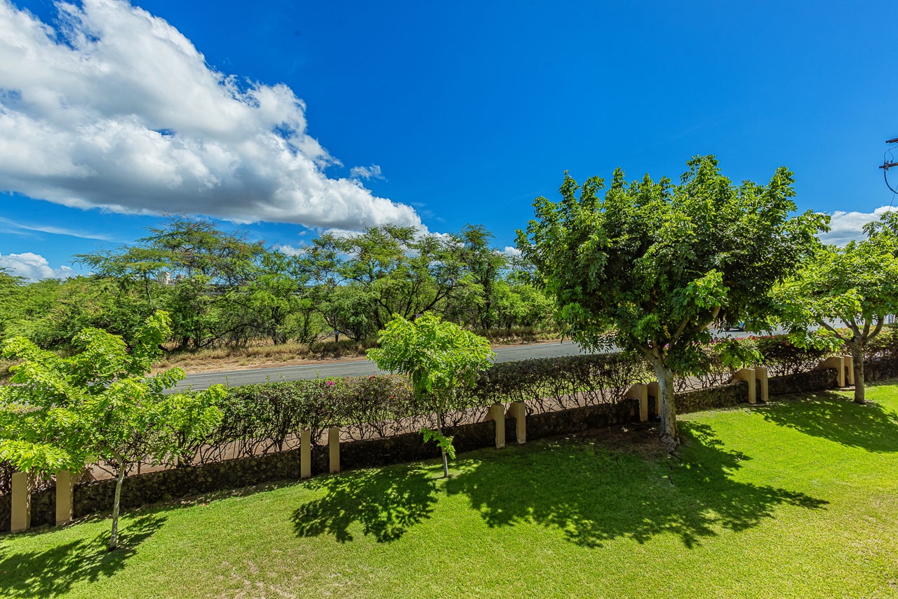 The property sits in a lush, leafy neighborhood with well-tended lawns and mature trees, offering a peaceful backdrop for your getaway.