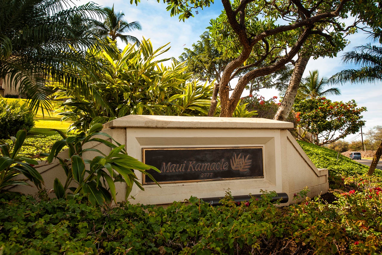 Welcome to Maui Kamaole, where lush tropical gardens greet you at the entrance. The property's natural setting creates a peaceful Hawaiian retreat.