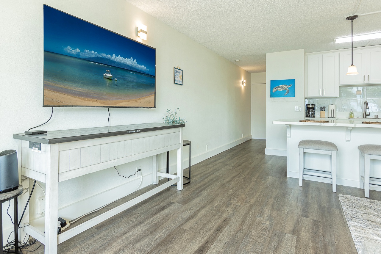 Cook, sip, and stream in open-concept living made easy