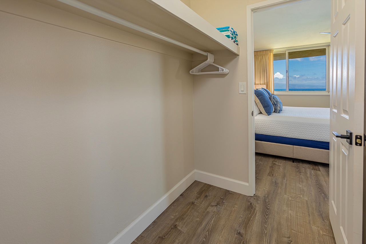 Step into your spacious walk-in closet with plenty of hanging space, connecting directly to the bedroom overlooking stunning ocean views.