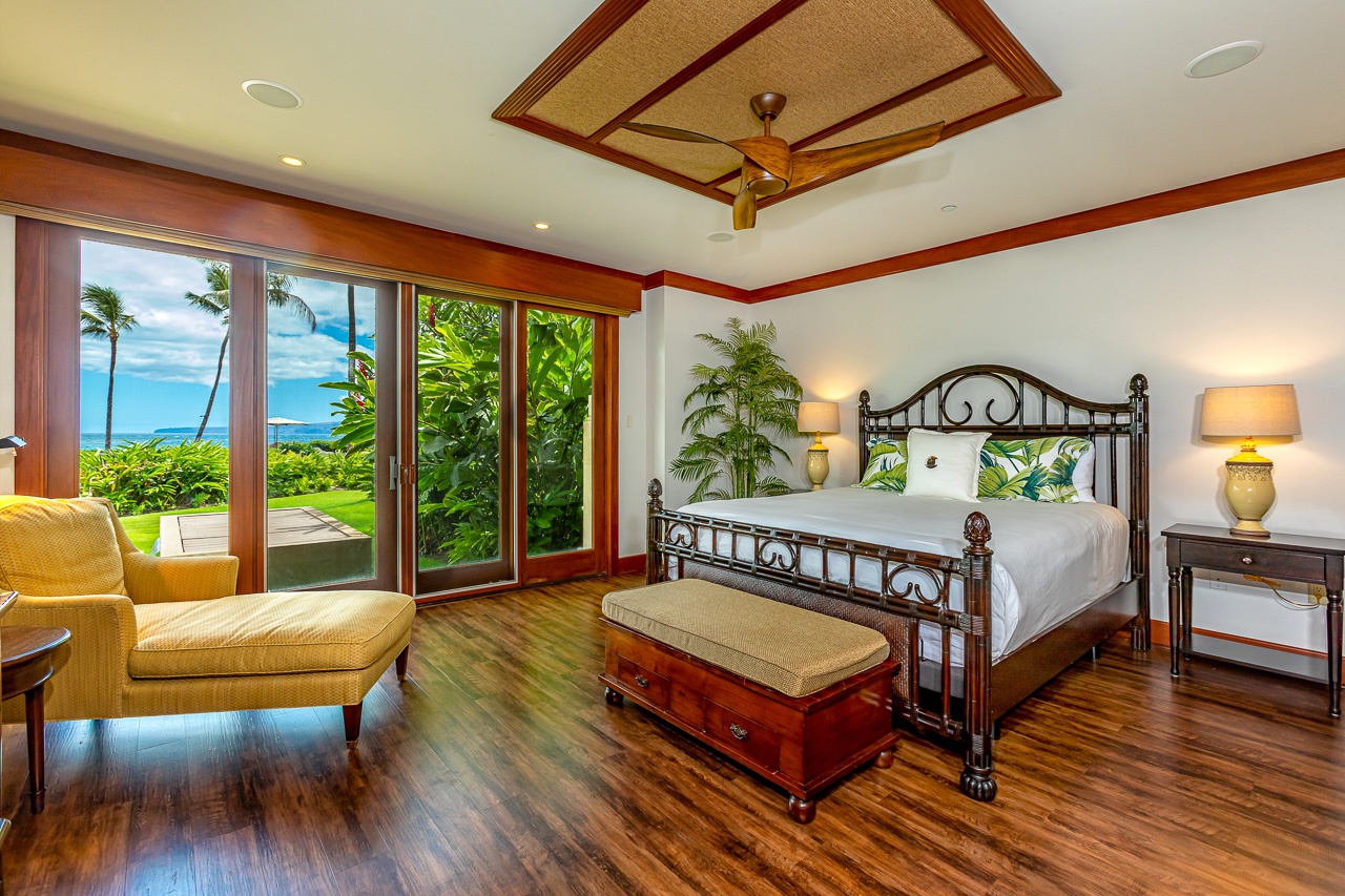 Wake up in your tropical sanctuary with stunning ocean views through expansive glass doors. Rich hardwood floors and elegant island-style decor set the perfect tone for your Hawaiian escape.