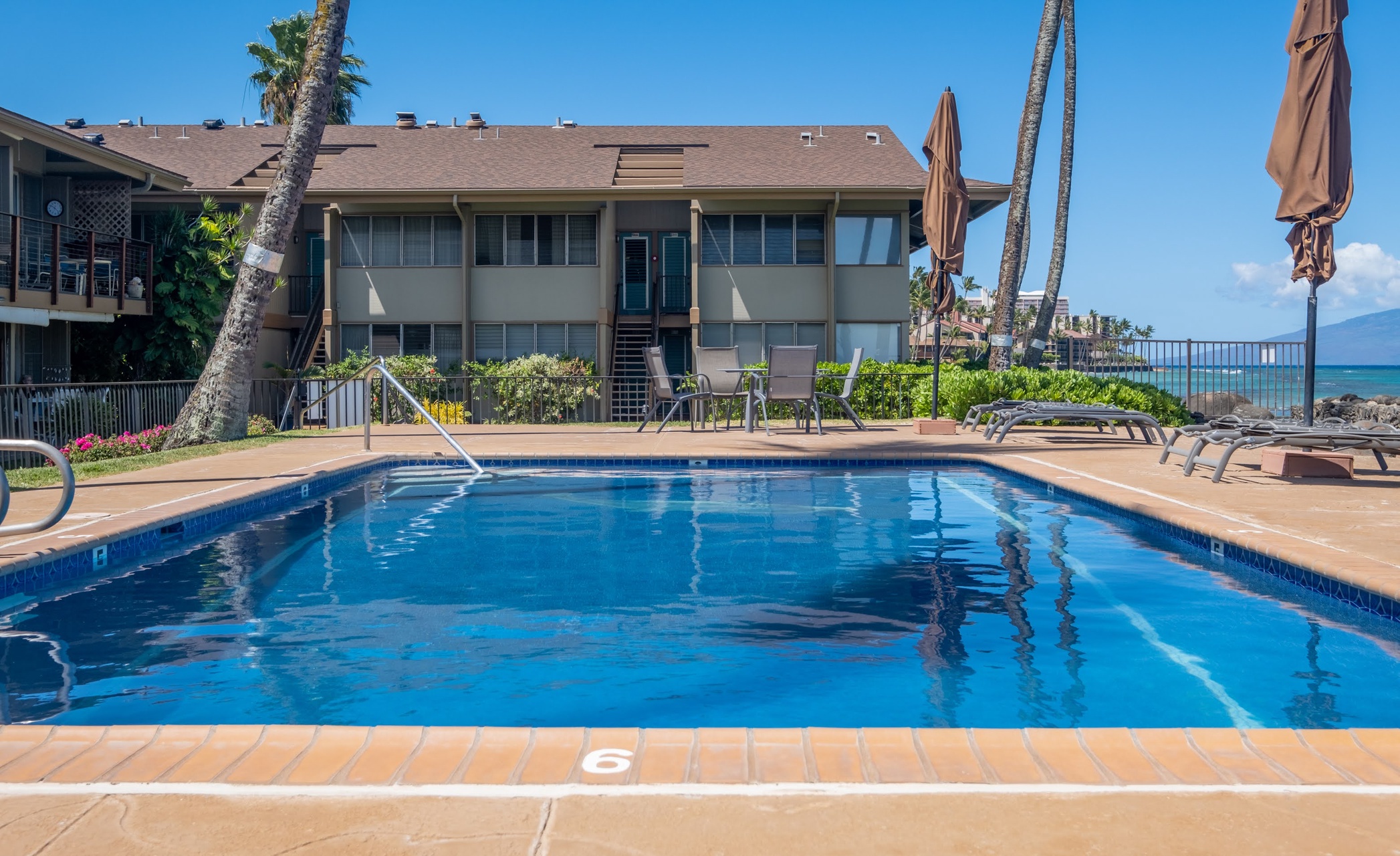 An inviting outdoor pool on property grounds, perfect for your Hawaiian escape.