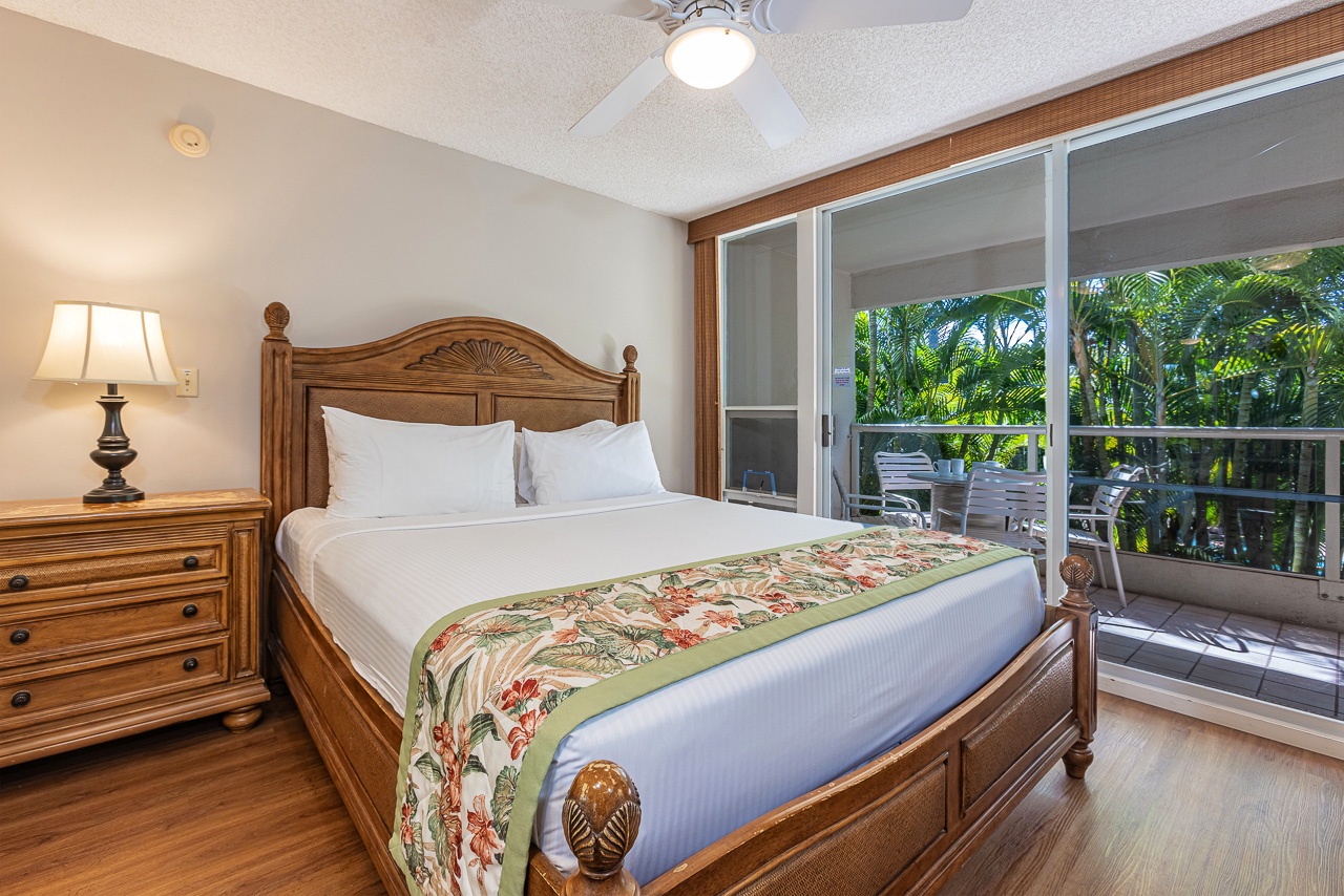 King bedroom with private lanai access and relaxing island charm