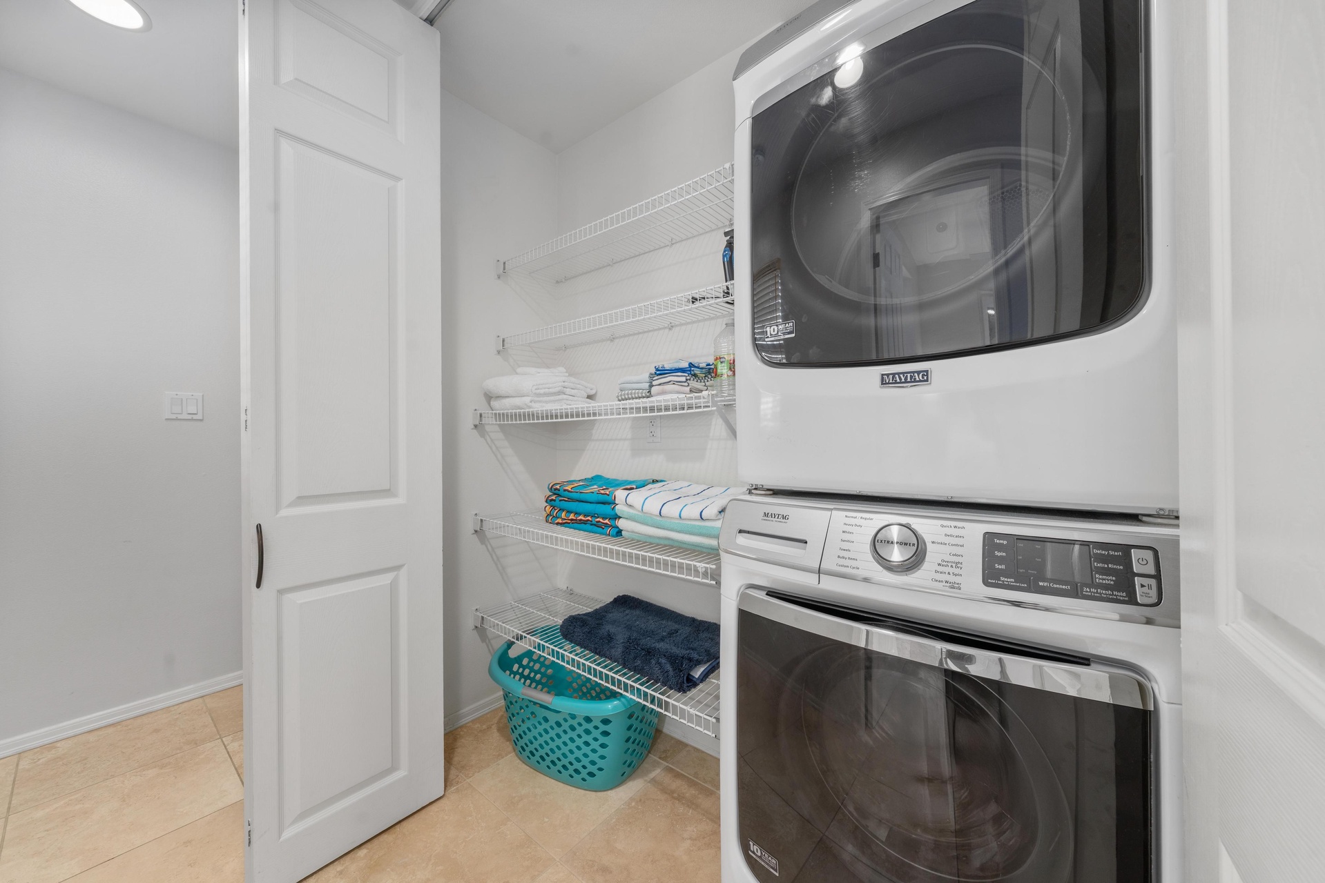 Your private laundry room keeps you organized with convenient shelving and full-sized washer and dryer.