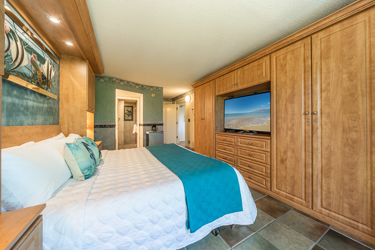 Sink into crisp white linens and coastal-inspired touches in your private retreat, complete with ample wardrobe space and entertainment for ultimate relaxation.