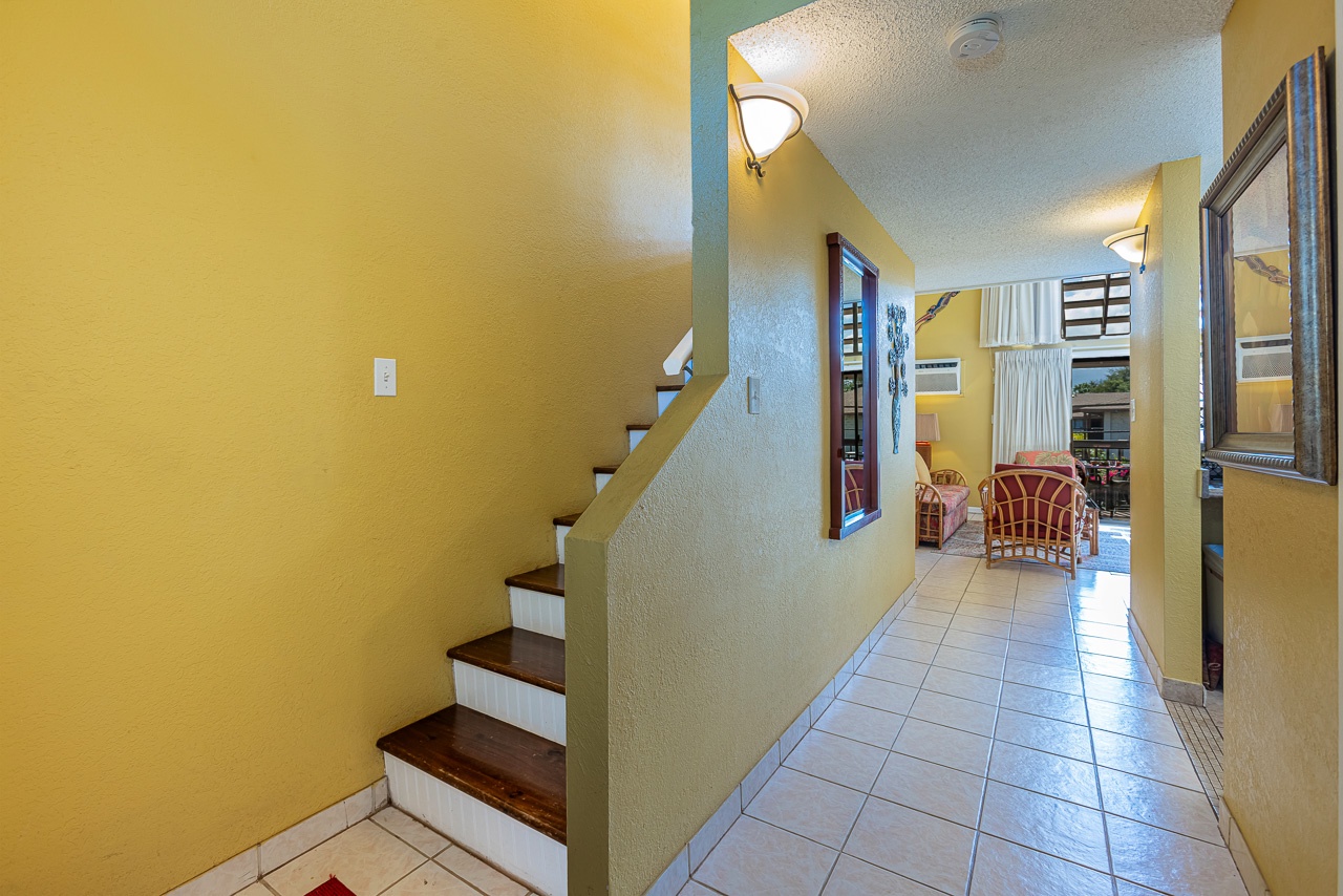 Welcoming entry with easy access to the kitchen and loft stairs