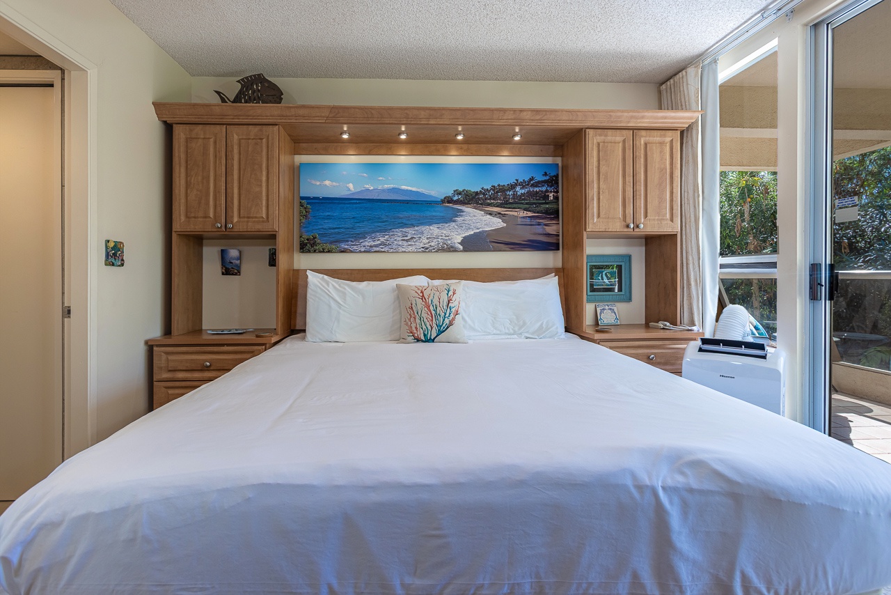Drift off in a cozy king bed after beach days