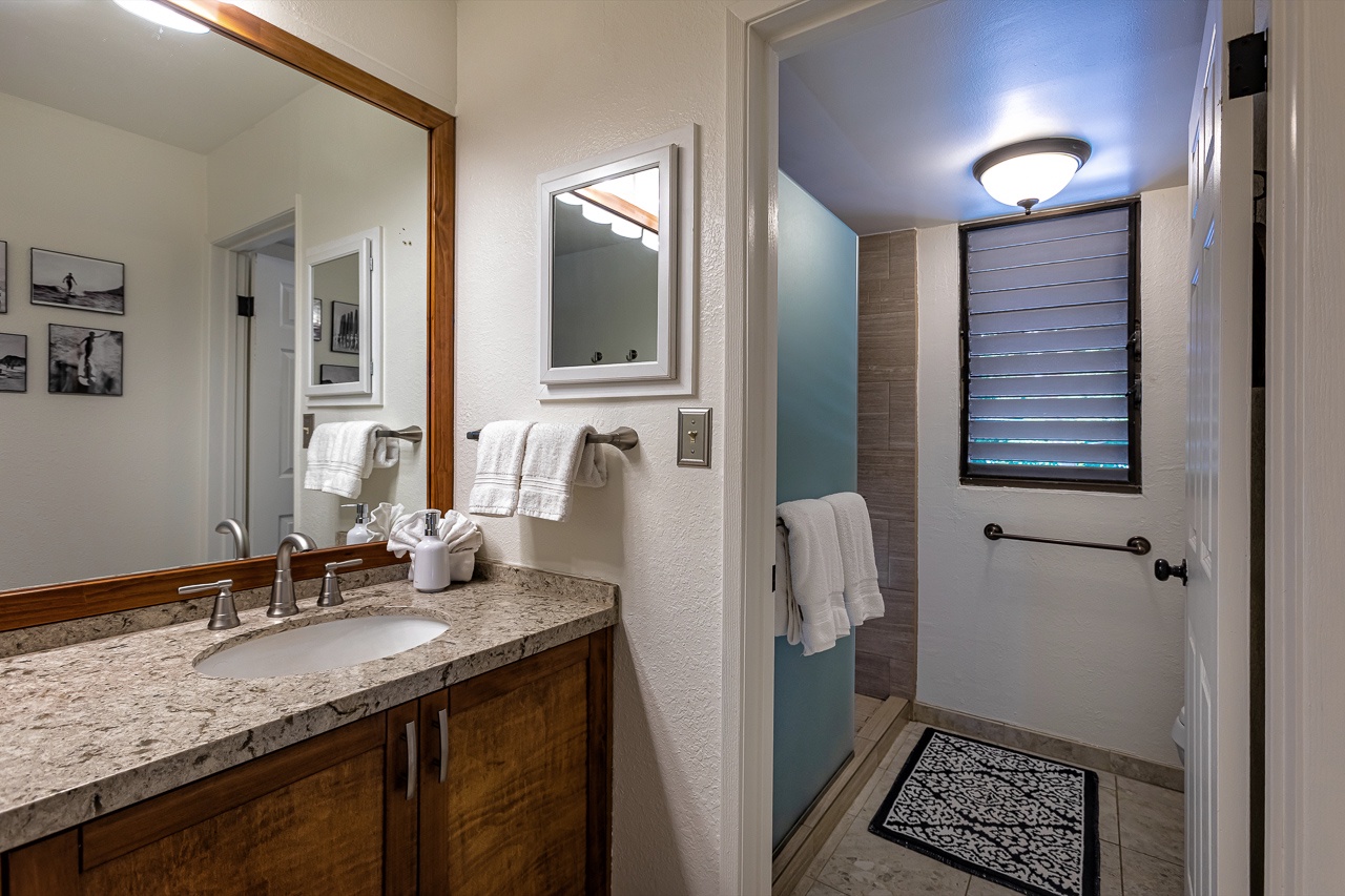 Primary en suite bathroom with spacious vanity area. 
