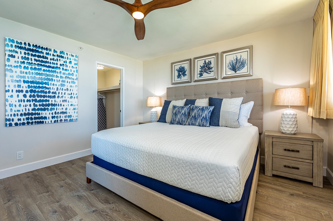 Sink into crisp linens and coastal charm in this serene bedroom, where ocean-inspired artwork and soft lighting create your perfect retreat after a day of adventure.